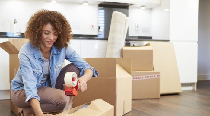 Woman Packing Boxes for Self Storage Unit