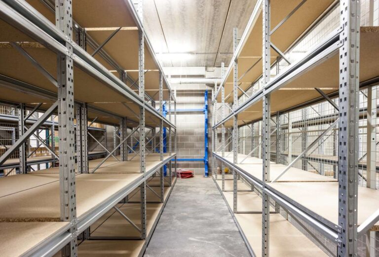 Large shelves and racks in a warehouse.